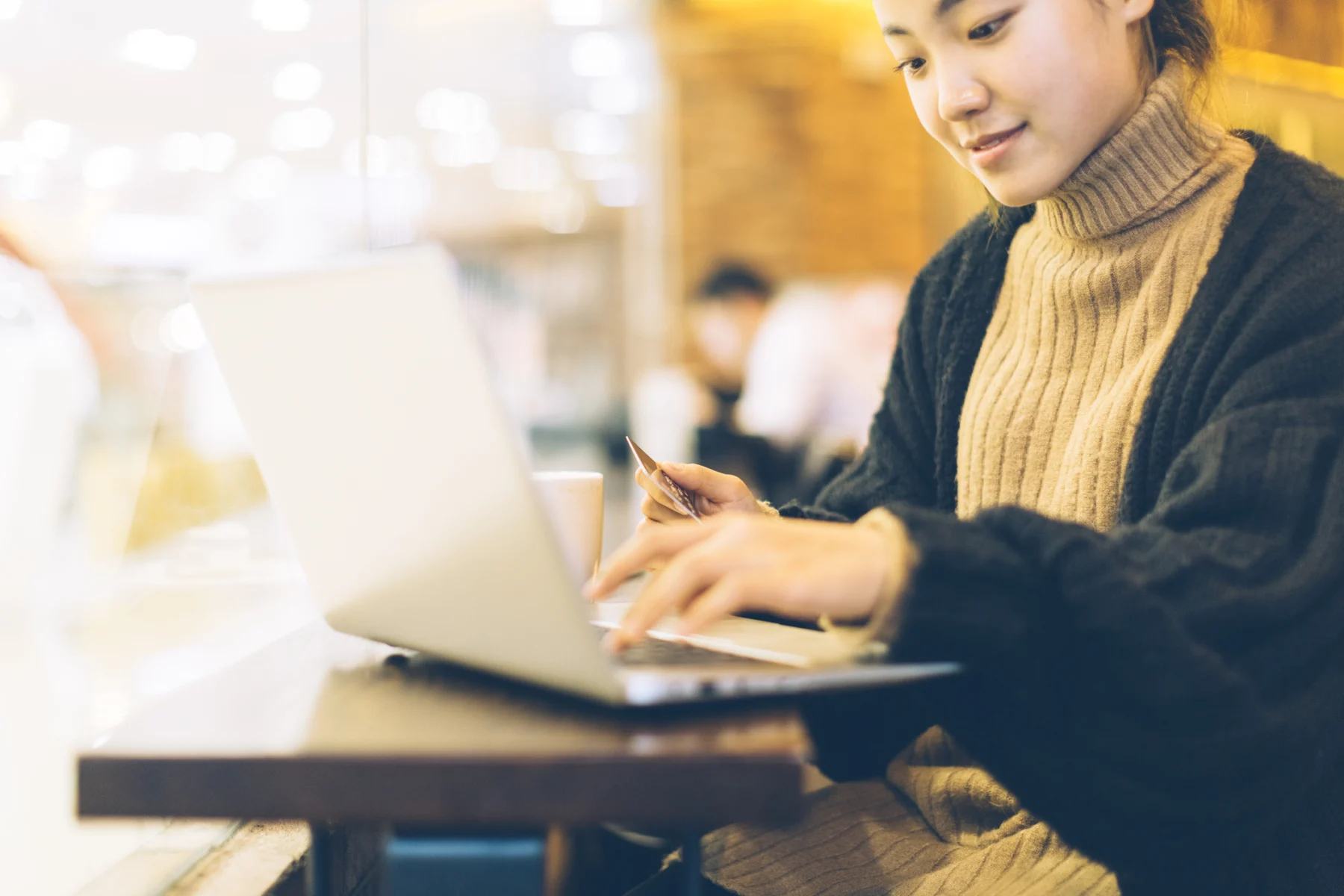 Woman_in_Sweater_Shopping_Online